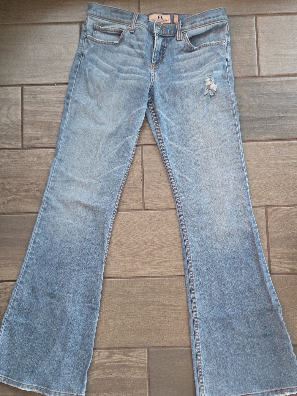 Juicy Couture Light Blue Flare Jeans with Subtle Distress